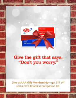 AAA Insurance brand holiday poster design displaying a AAA membership card with red ribbon..
